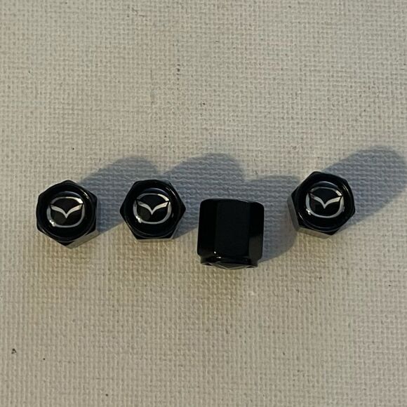 Mazda valve Stem caps in Black set of 4 NWT - Picture 1 of 4